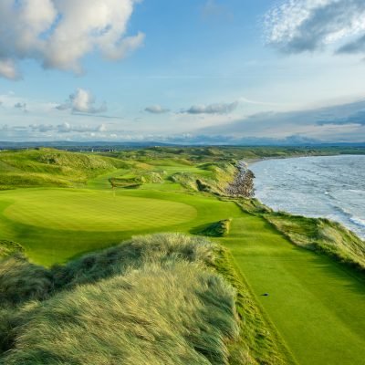 last light looking down the 11th hole and the 10th green of The Old Course at Ballybunion Golf Club in Ireland.