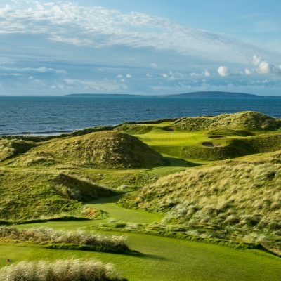 the classic ballybunion photo of the par 3 15th hole with the backdrop of the irish see.  One of the great holes in the world and great links golf courses as well.